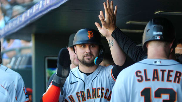 Sep 17, 2023; Denver, Colorado, USA; San Francisco Giants third baseman J.D. Davis (7) celebrates scoring a run in the sixth inning against the Colorado Rockies at Coors Field.